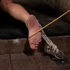 Annie Cruz in 'Nipples tied to toes, funnel gag directly below her pussy. Made to squirt like a fountain!'