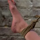 Jennifer White in 'Bound with her leg up and wet pussy exposed this beautiful thing is made to cum over and over.'