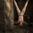Madison Young in 'Redhead suspended by ankles with rope, face fucked Flogged until her skin is bright pink.'