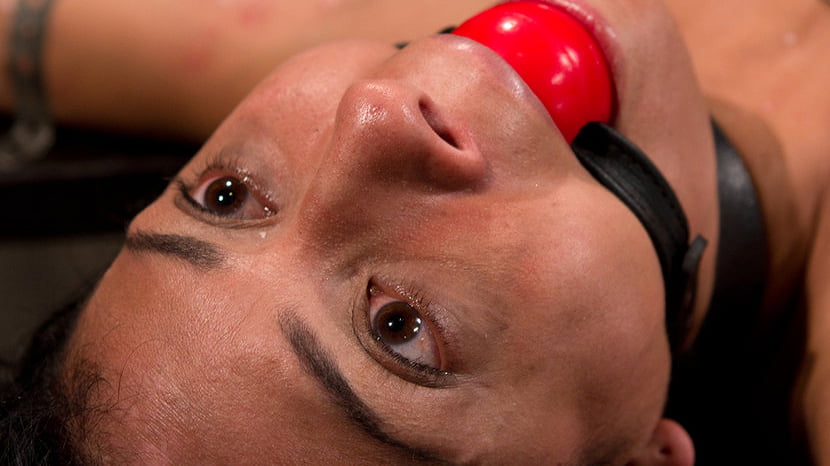 Bound by metal, covered in wax, fucked by machine