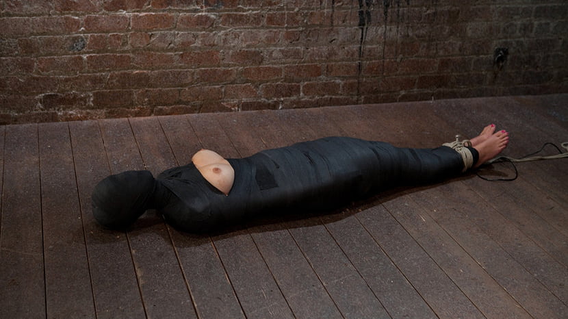 Cute little blond girl is mummified, vibrator stuck on her clit. Hung upside down to cum and cum.