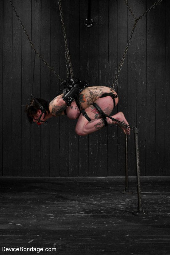 Kathryn Dupri Submits to Leather Restraint